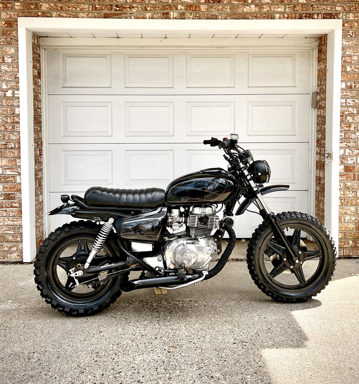 1980 Honda CM400 Scrambler in front of garage